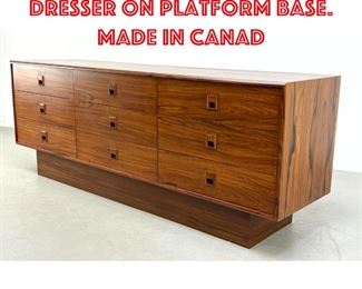 Lot 336 Rosewood Triple dresser on platform base. Made in Canad