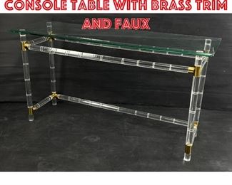 Lot 363 Lucite and glass Console table with brass trim and faux