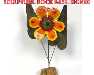 Lot 392 C JERE Enamel Flower Sculpture. Rock base. Signed and d