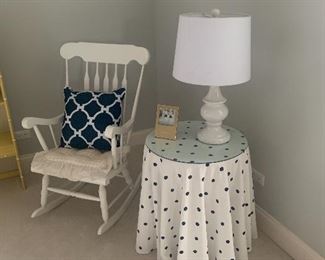 White rocking chair 
Round tables
