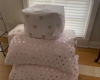 3 Pink Poufs
2 Pink Lounging Pillows