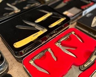 Very large selection of commemorative knife sets.