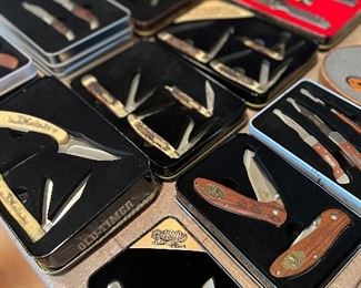 Very large selection of commemorative knife sets.