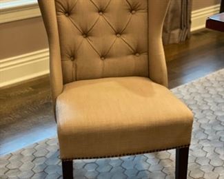 Arhaus upholstered captain chair with tufted back - 2 available. Each measures 24" W x 24" D; 18.5" seat height. Photo 1 of 2.