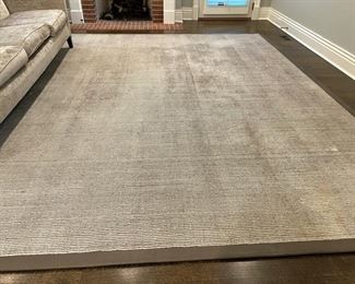 Neutral rug with leather trim. Measures 11' 6" x 12' 7". Photo 1 of 2.