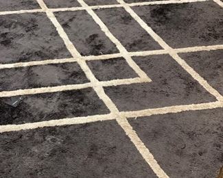 Smokey grey and white area rug. Measures 8' x 10'.