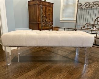 Linen upholstered bench with nailhead trim and lucite legs. Measures 48" x 18" D x 18" H. Photo 1 of 3.