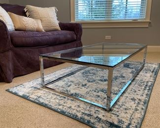 Chrome and glass cocktail table. Measures 48" W x 24" D x 12" H. Photo 1 of 2.
