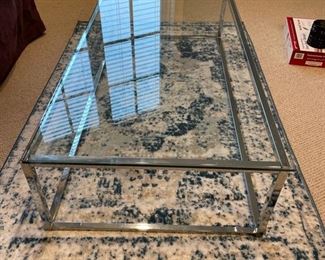 Chrome and glass cocktail table. Measures 48" W x 24" D x 12" H. Photo 2 of 2.