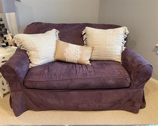 Crate & Barrel twin sleeper sofa with purple slipcover. Measures 57" W x 37" D.