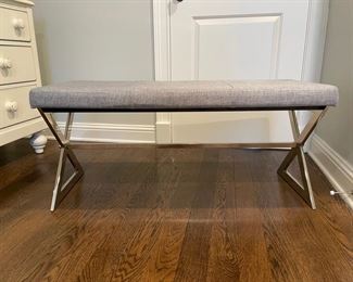 Upholstered bench with chrome cross-leg base. Measures 40" W x 18" D x 18" H. Photo 1 of 3.
