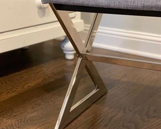 Upholstered bench with chrome cross-leg base. Measures 40" W x 18" D x 18" H. Photo 3 of 3.