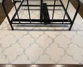 Neutral area rug. Measures 7' 5" x 9' 7".