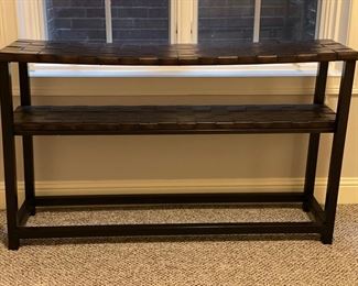 Console with woven leather shelves. Measures 54" W x 18" D x 31"H. Photo 1 of 3.
