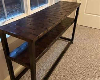 Console with woven leather shelves. Measures 54" W x 18" D x 31"H. Photo 2 of 3.
