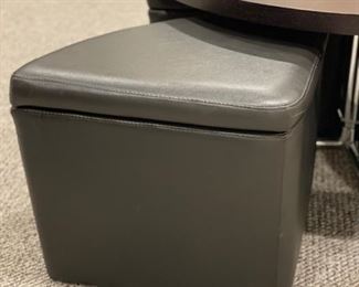 Cocktail table with four hide-away leather storage seats. Table can be raised to create a dining surface. Table measures 40" D. Photo 3 of 3.