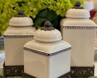 Set of three storage canisters.