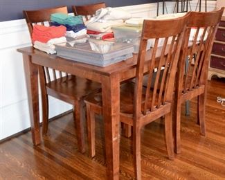 Small dining/kitchen table with 4 matching chairs along with a variety of linen napkins and table cloths