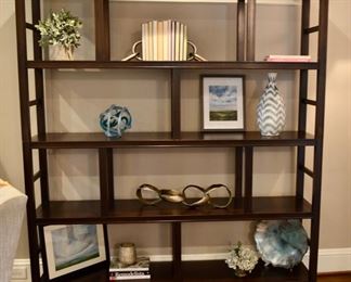 High Cotton shelving unit with assorted shelf and table-top decor and accessories