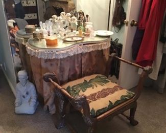 Glass top vanity, perfume bottle collection, carved bench