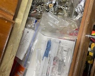 Large selection of tools, wood scraps and hardware