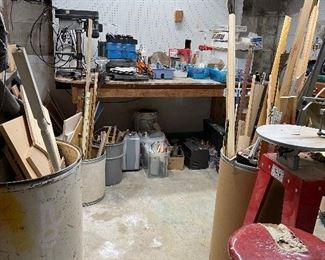 Large selection of tools, wood scraps and hardware