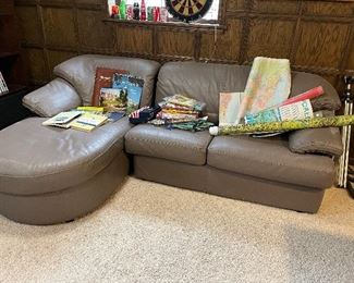 Leather sectional, maps, vintage books, global flag collection