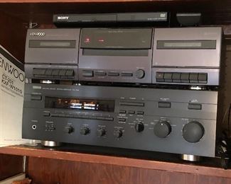 Stereo equipment: Kenwood CT-201 double cassette deck, Yamaha RX-596 stereo receiver, Sony CD/DVD player w/ remote (DVP-SR210P)