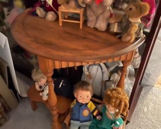 Oak table, dolls, and bears