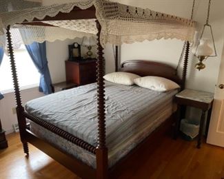 Antique cherry spool bed with wood canopy  shown with hand crochet coverlet