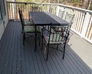 Pottery Barn Outdoor Dining Set. Table has hole in center for umbrella. 4 side chairs, 2 Armchairs and Pottery Barn seat cushions. Table height: 30". Length: 6 feet. Width: 38". Chairs are 37.5" high at back. Armchairs are 24" wide. Side Chairs are 18" wide PRICE $ 850