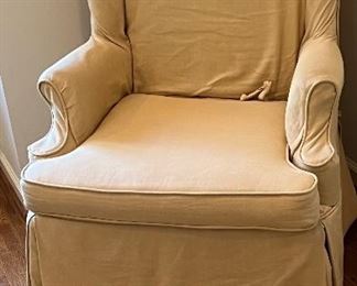 Vintage wingback chair with twill slipcover H: 44". W: 31". D: 28" PRICE $75