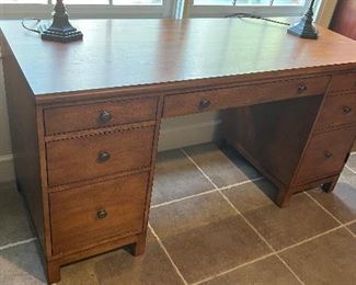 PRICE $ 950. Ethan Allen Continental Double Pedestal Desk. Current retail price of $3,750.00. Center drawer opens and can fold down for keyboard. Right side opens for cabinet storage of paper or CPU. Left side has 2 drawers and one file drawer.
H: 31". W: 60". D: 24". Excellent condition.