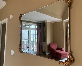 Vintage mirror with ornate gilt edges. 33" x 45". PRICE $65