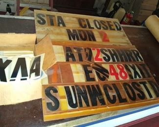 Small store window sign with extra letters