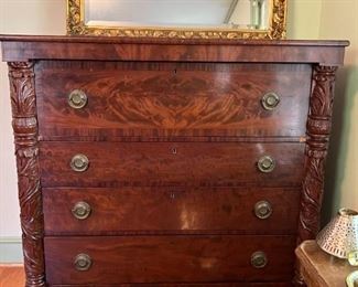 Antique Flame Mahogany Chest/Secretary with ornately carved embellishments and claw feet