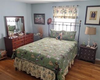 Someone in this house LOVED dogs, SO there's a cute doggie-themed quilt on this vintage iron and brass queen size bed, vintage cherry wood 8-drawer dresser, by Jamestown Sterling Corp. (Jamestown, NY) small wooden apothecary chest, vintage maple magazine rack and decent framed artwork.