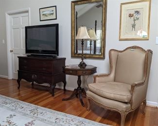 1940's mahogany Lane cedar chest, hexagonal wooden table, with four drawers, wonderful cotton upholstered wingback armchair, by Meyer, Gunther, Martini - NYC, with down-filled cushion, nicely framed/matted artwork and gold wall mirror, with beveled glass.