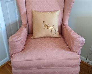Comfy reupholstered wingback armchair, spruced up with a shiny lizard pillow that's a must-have in Sandy Springs!