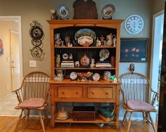 Vintage two-piece pine hutch, by the Country Craftsman, Cave Spring, GA, set/3 pewter Bicentennial plates, vintage cookbooks, face jug, porcelain and earthenware pitchers, woven baskets (one Longaberger) pair of red wood/woven seat stools and vintage wall sign. 