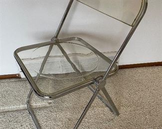 Plia Acrylic/steel folding chairs.  