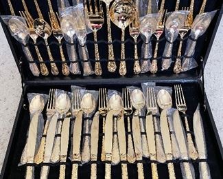 WM Rogers & Sons Gold Tone Flatware.  51 piece.  Twelve, 4pc. place settings with 3 service pieces.