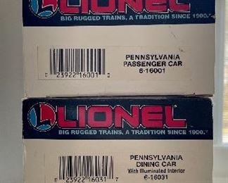 Item 127:  Lionel Erie Lackawanna Box Car:  $35                                         Item 128:  Lionel Pennsylvania Passenger Car:  $28                                Item 129:  Lionel Pennsylvania Dining Car with Illuminated Interior:  $35                                                                                                Item 130:  Lionel Pennsylvania Observation Car:  $30