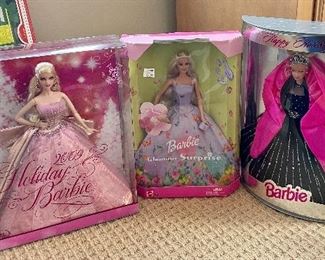 Item 133:  2009 Holiday Barbie:  $30                                                         Item 134:  Barbie Glamour Surprise:  $20                                                     Item 135:  Barbie Happy Holiday:  $15