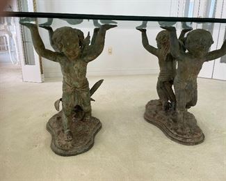 3_____ $1,150 
Glass top Bronze angel base dining table 6L x 44Wx 30H