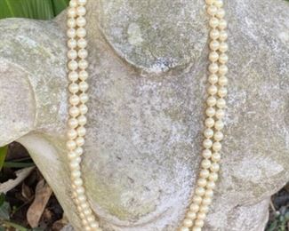 F - $100 - Strand of long pearls