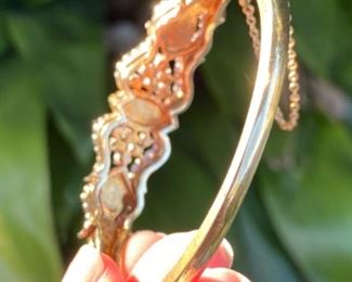 L - $2,350 - Opal & Diamonds bracelet. Ladies 14kt yellow bangle bracelet set with 3 marquise shaped opals that measure 12x6mm, 10x5mm, & 10x5mm. Total of 1.5 ct of round diamonds mele. Color : G/H. Clarity Si-1/2. All stones are natural and prone set. 31 grams. Appraisal included. 