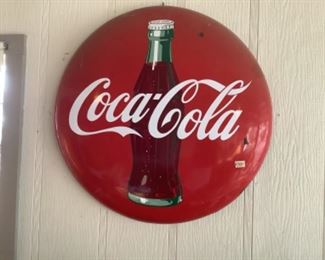 Coca-Cola button sign