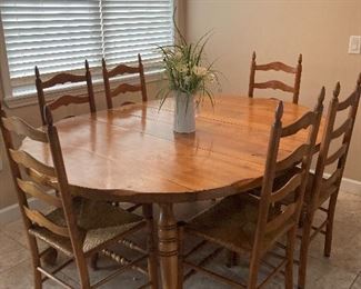 Solid wood pine dinning table with six pine chairs with Cain bottoms