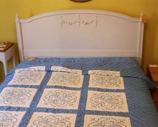 Beautiful painted bed, quilt and round framed vintage print.